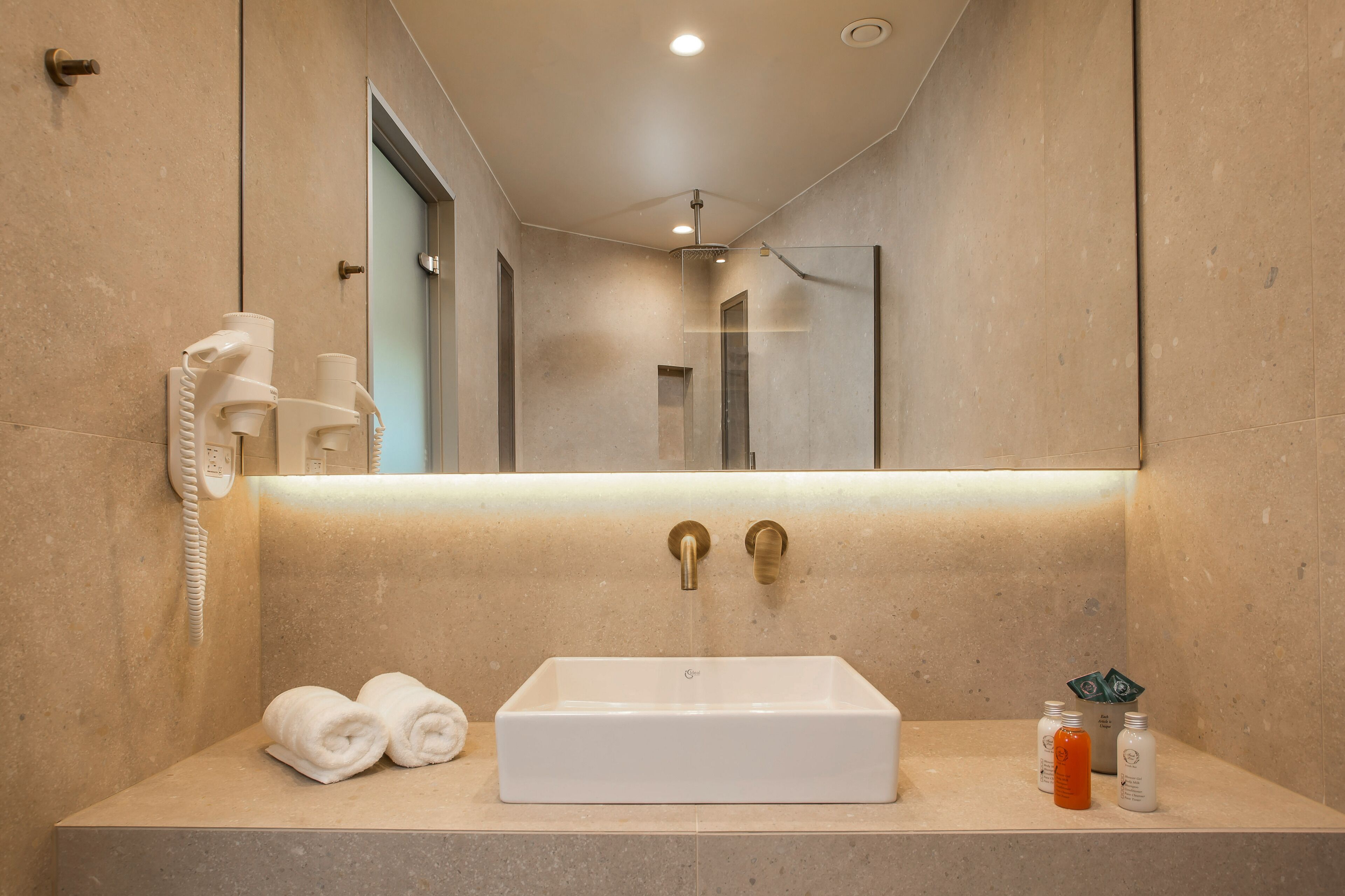 premium double room | bathroom | rainfall showerhead, hair dryer, towels, soap