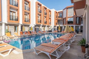 Seasonal outdoor pool, pool umbrellas, sun loungers