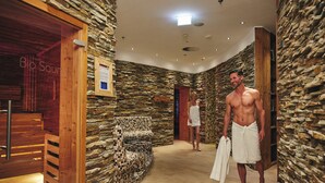 A stone-walled spa area with wooden benches and a wooden door labeled "Bio Sauna". - HANSE HOTEL Attendorn (Attendorn)