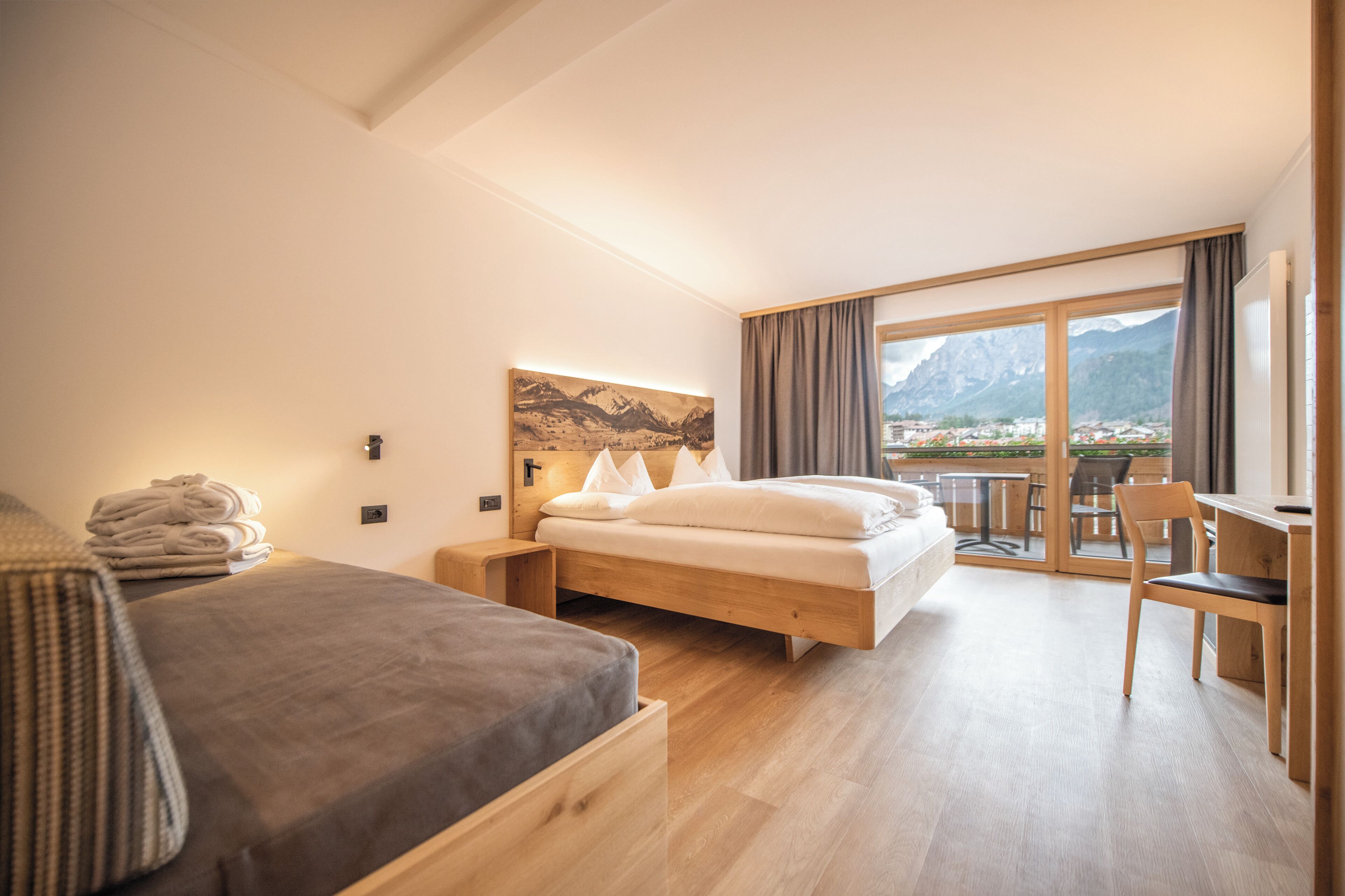 Superior Triple Room | Minibar, in-room safe, desk, laptop workspace