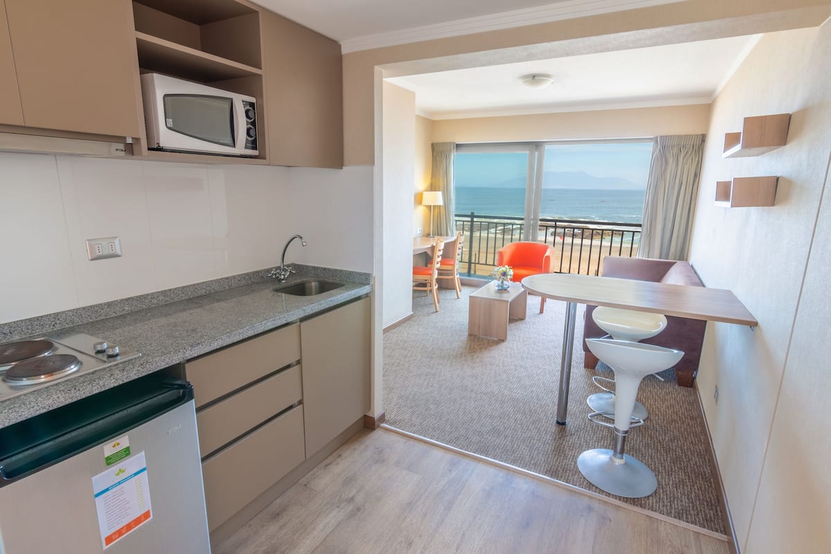 superior room, 1 queen bed, balcony, beach view | private kitchenette