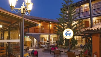 Hypo-allergenic bedding, desk, laptop workspace, blackout drapes