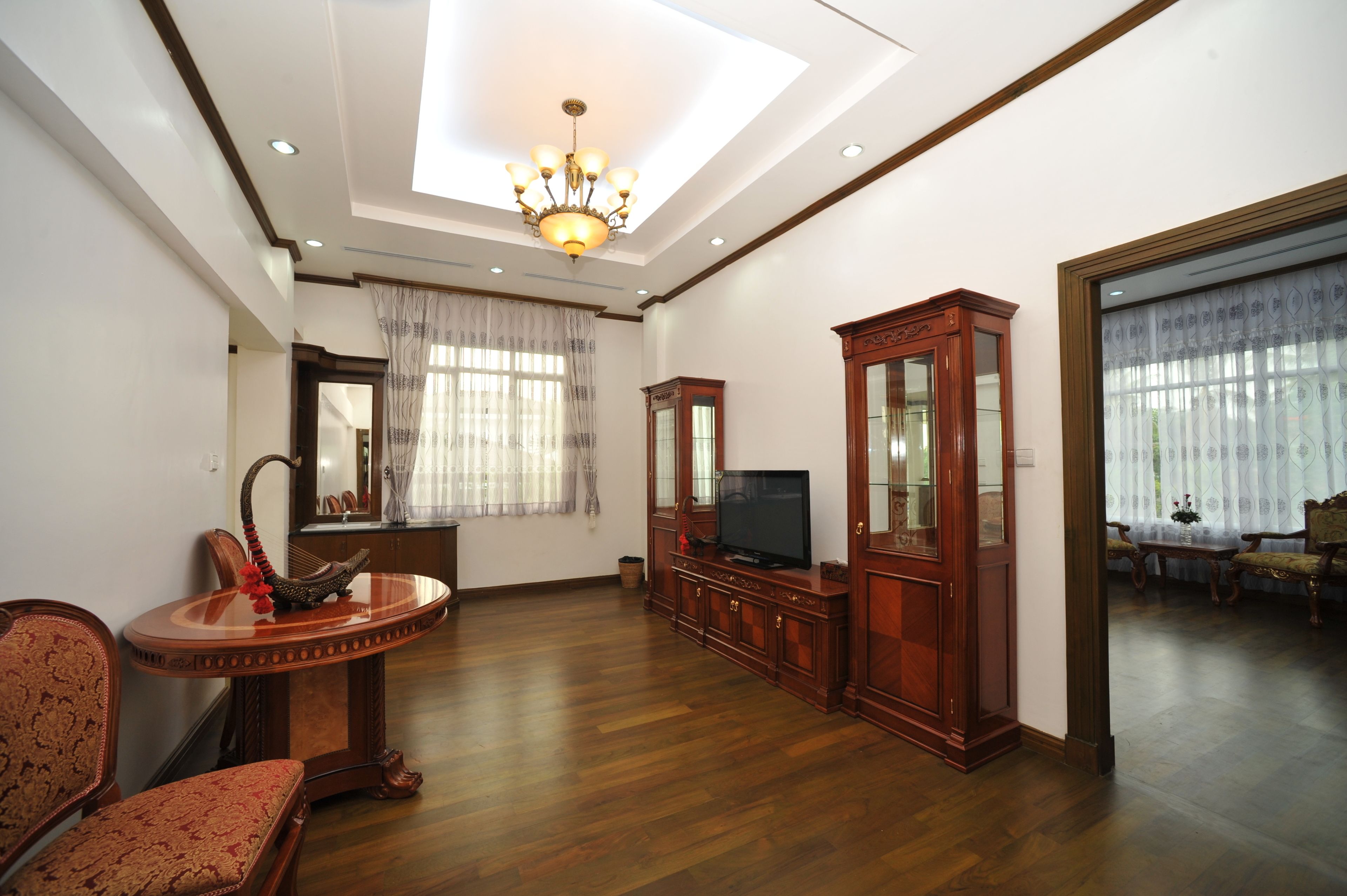 junior luxury suite | living area | 45-inch plasma tv with satellite channels, tv, dvd player