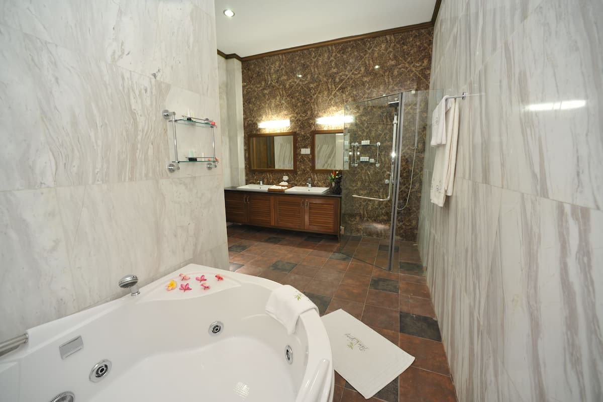 luxury suite | bathroom | rainfall showerhead, free toiletries, hair dryer, bathrobes