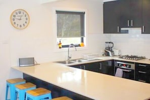 Deluxe 3 Bedroom Loft-Style Lodge | Private kitchen | Coffee/tea maker