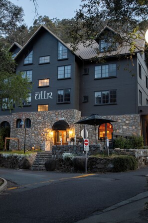 A building with a stone facade and a sign reading "House of Ullr." - House of Ullr (Thredbo)