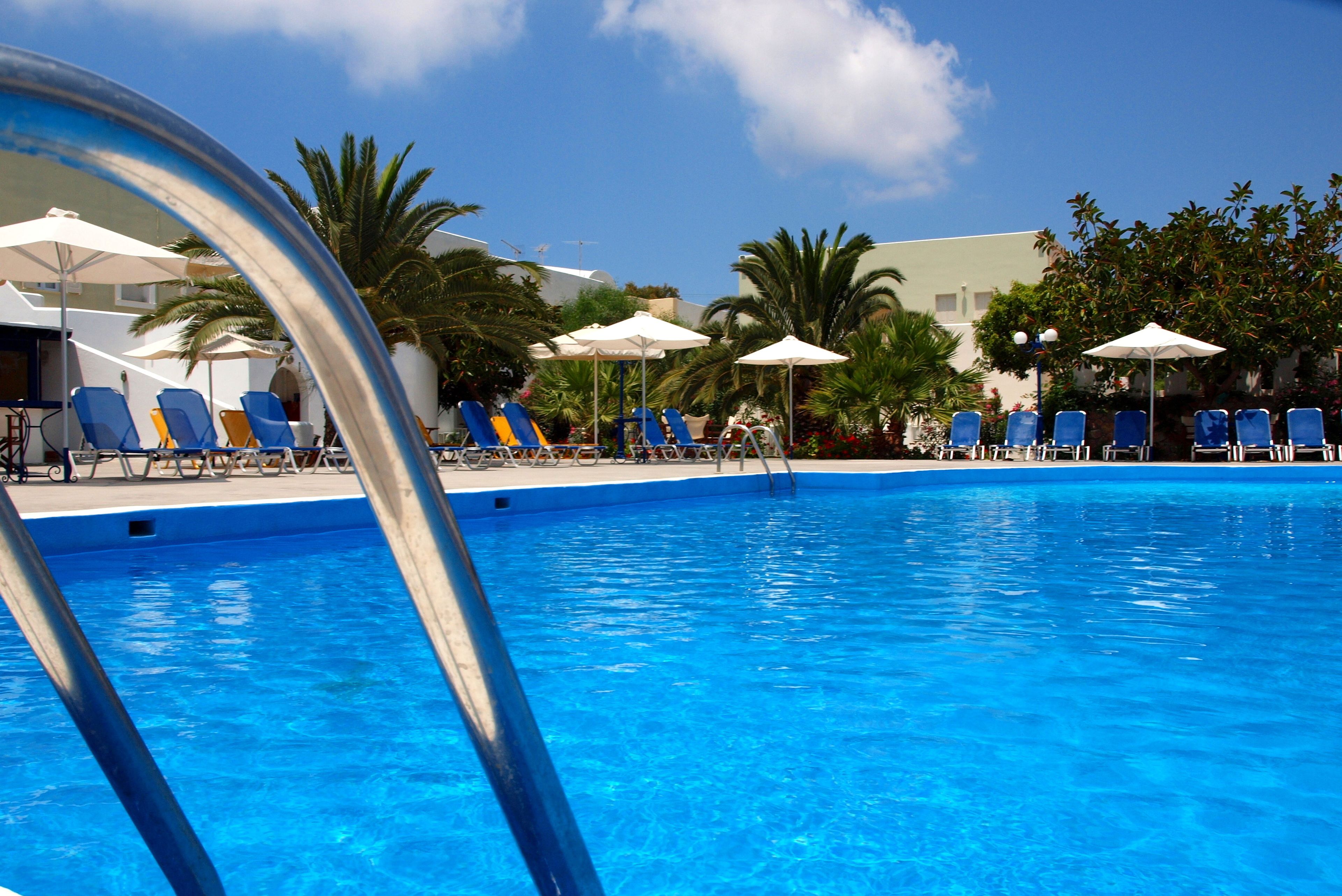 seasonal outdoor pool, pool umbrellas, pool loungers