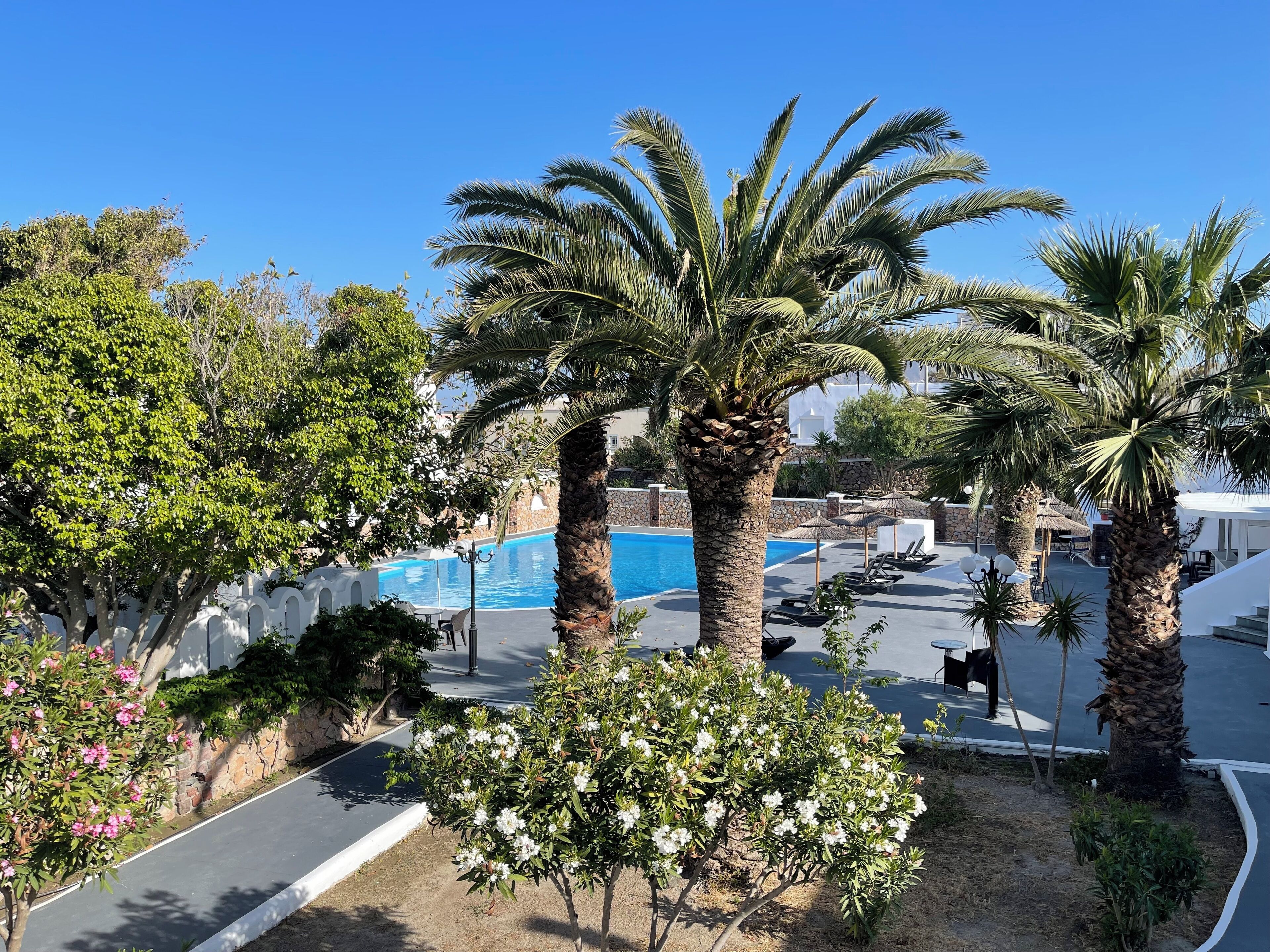 seasonal outdoor pool, pool umbrellas, pool loungers