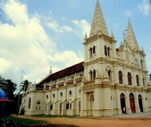 A large, ornate building with two prominent towers and a central dome, likely a historical or religious structure.