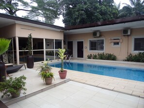 Outdoor pool, pool umbrellas, sun loungers