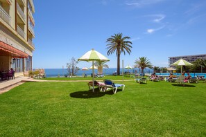 Seasonal outdoor pool, pool loungers