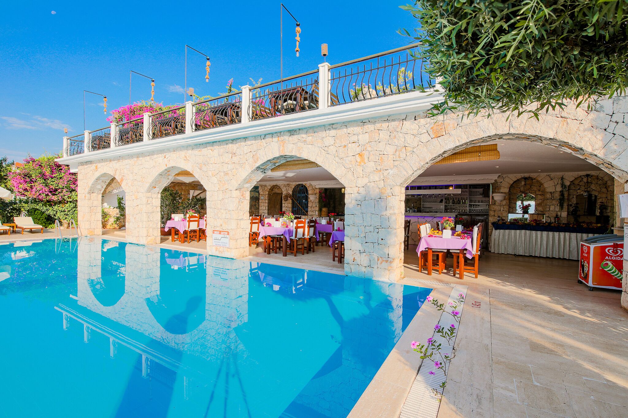 outdoor pool, pool umbrellas, pool loungers