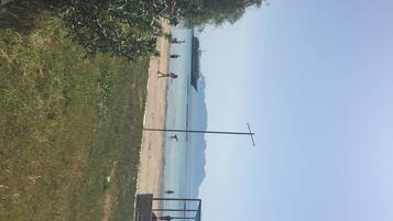 On the beach, sun loungers, beach umbrellas