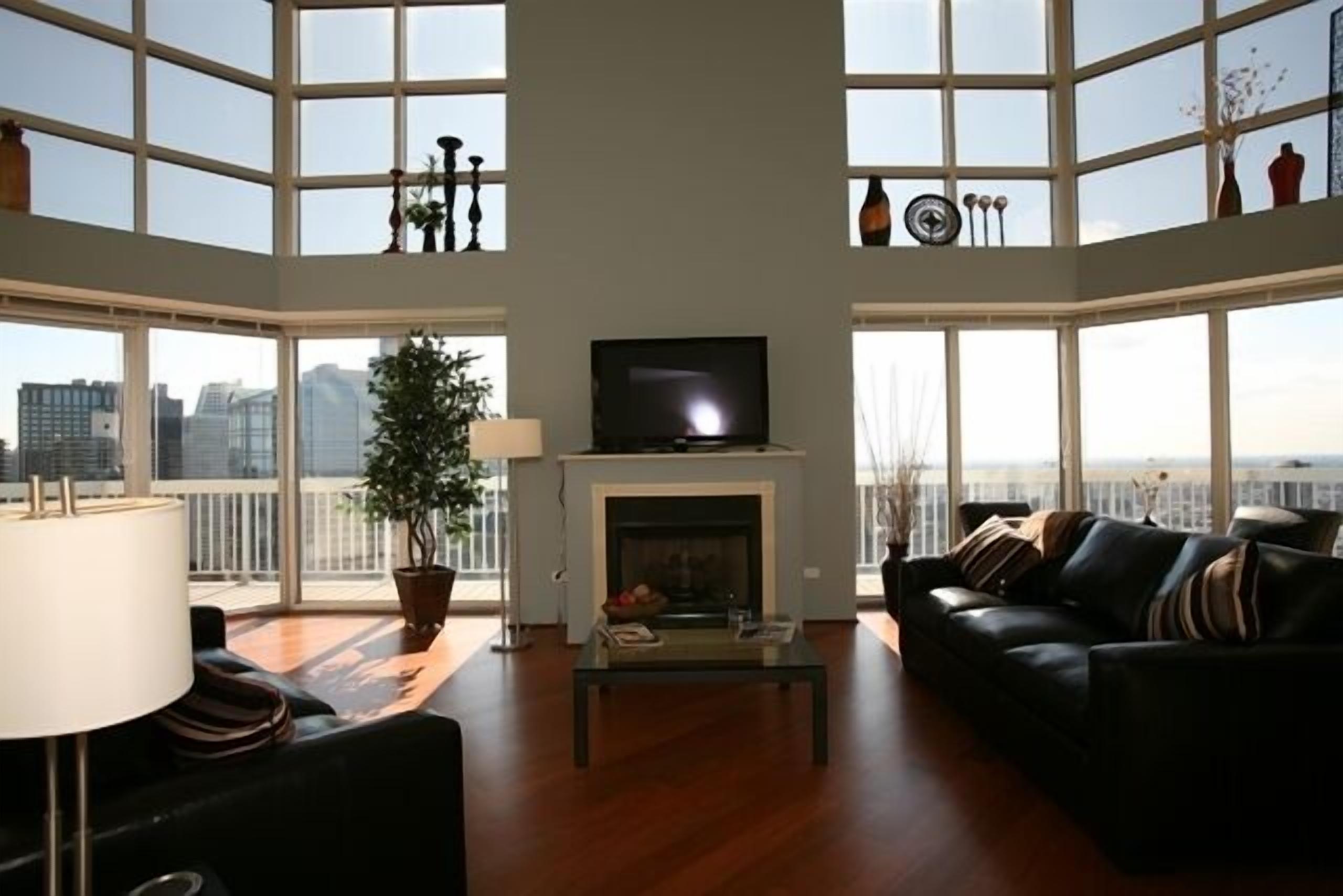 penthouse 2 | living area | flat-screen tv, fireplace