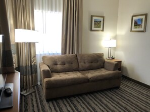 Suite, 1 King Bed with Sofa bed, Non Smoking | Living area | 44-inch LED TV with digital channels, TV, streaming services - Navajoland Inn (St. Michaels)