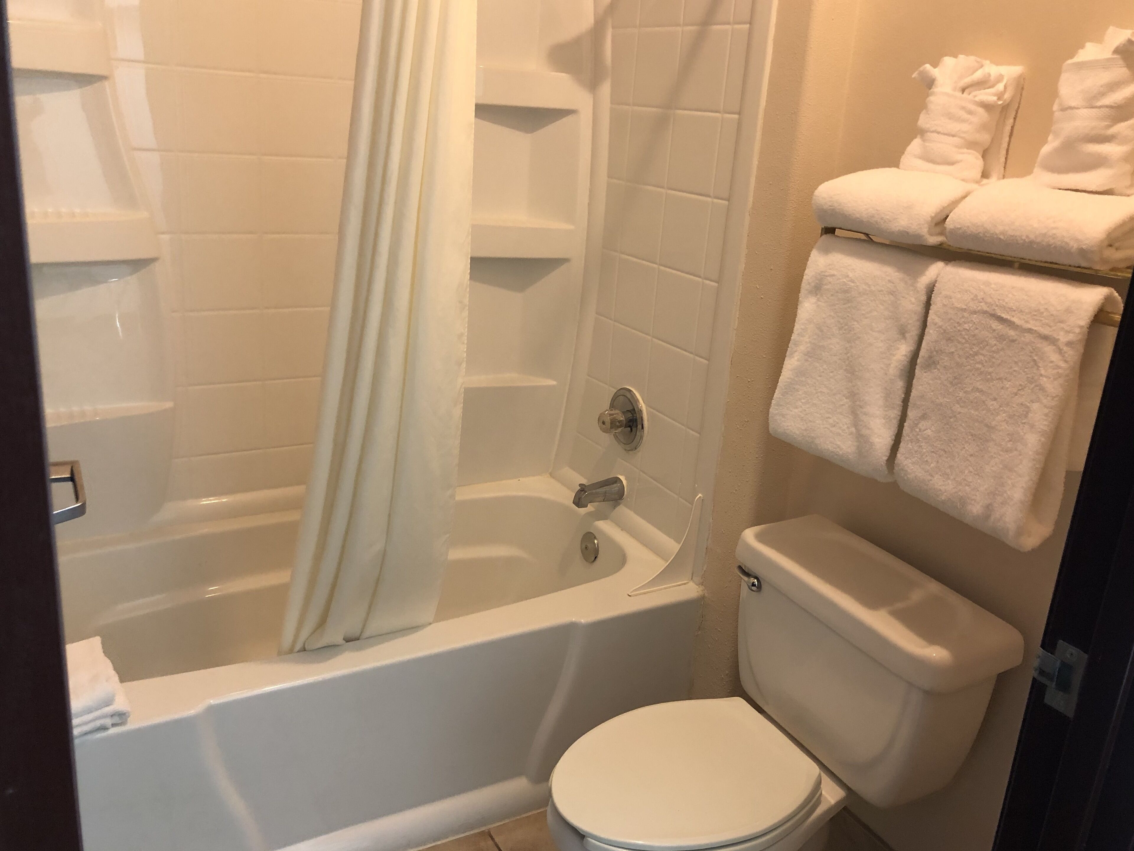 combined shower/bathtub, hair dryer, towels, soap