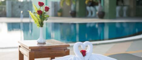 Outdoor pool, open 7 AM to 10 PM, pool umbrellas, pool loungers