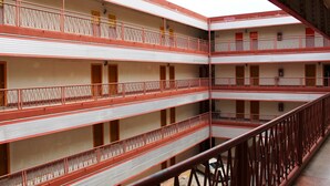 A multi-story building with balconies and railings. - Phu Inn Hotel (Khon Kaen)