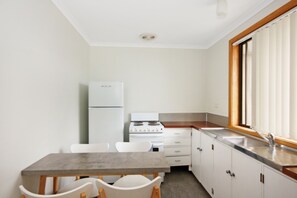 The One Bedroom Classic Unit | Private kitchen | Fridge, microwave, stovetop