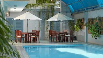 Outdoor pool, open 10:00 AM to 10:00 PM, sun loungers