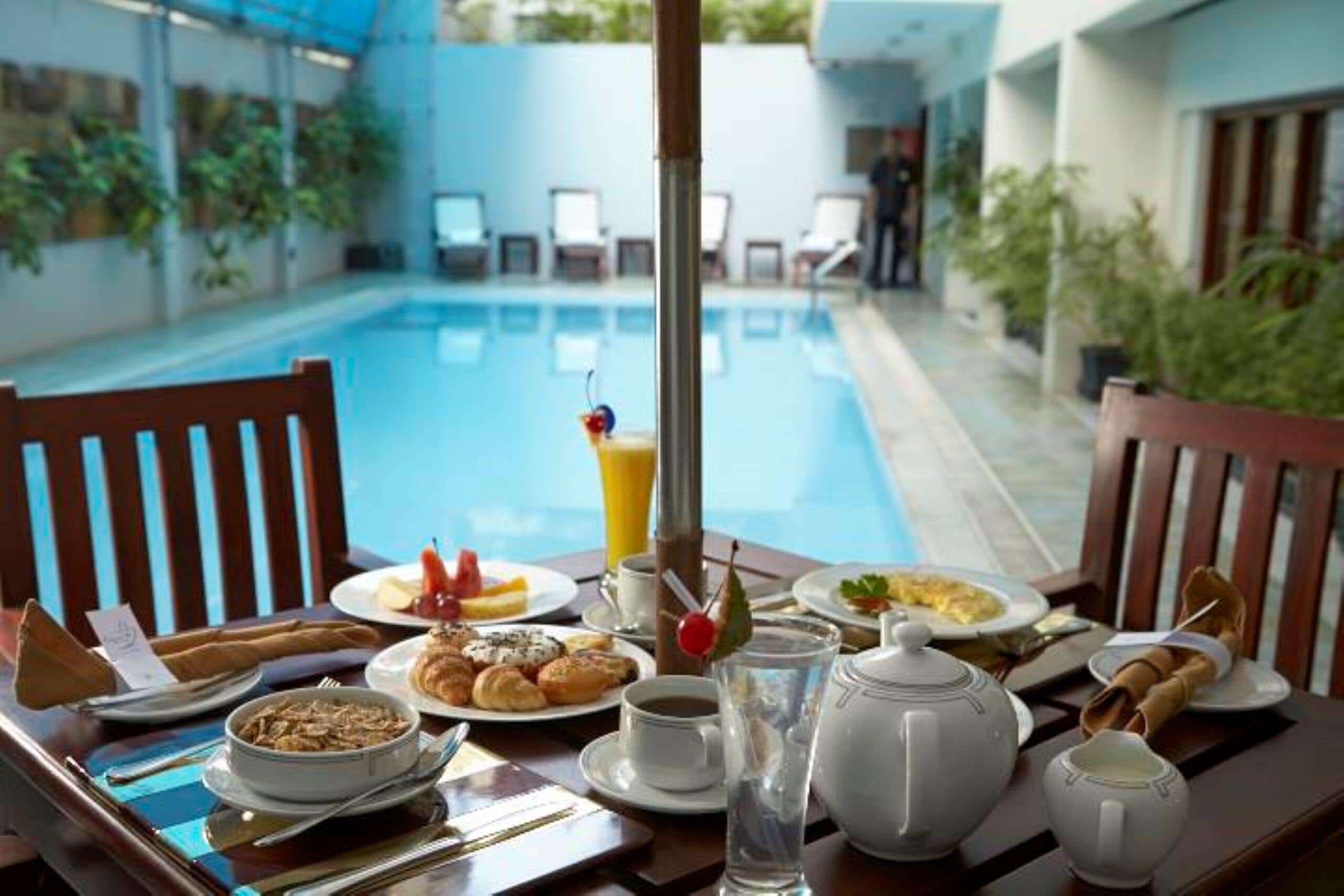 Outdoor pool, open 10:00 AM to 10:00 PM, pool loungers