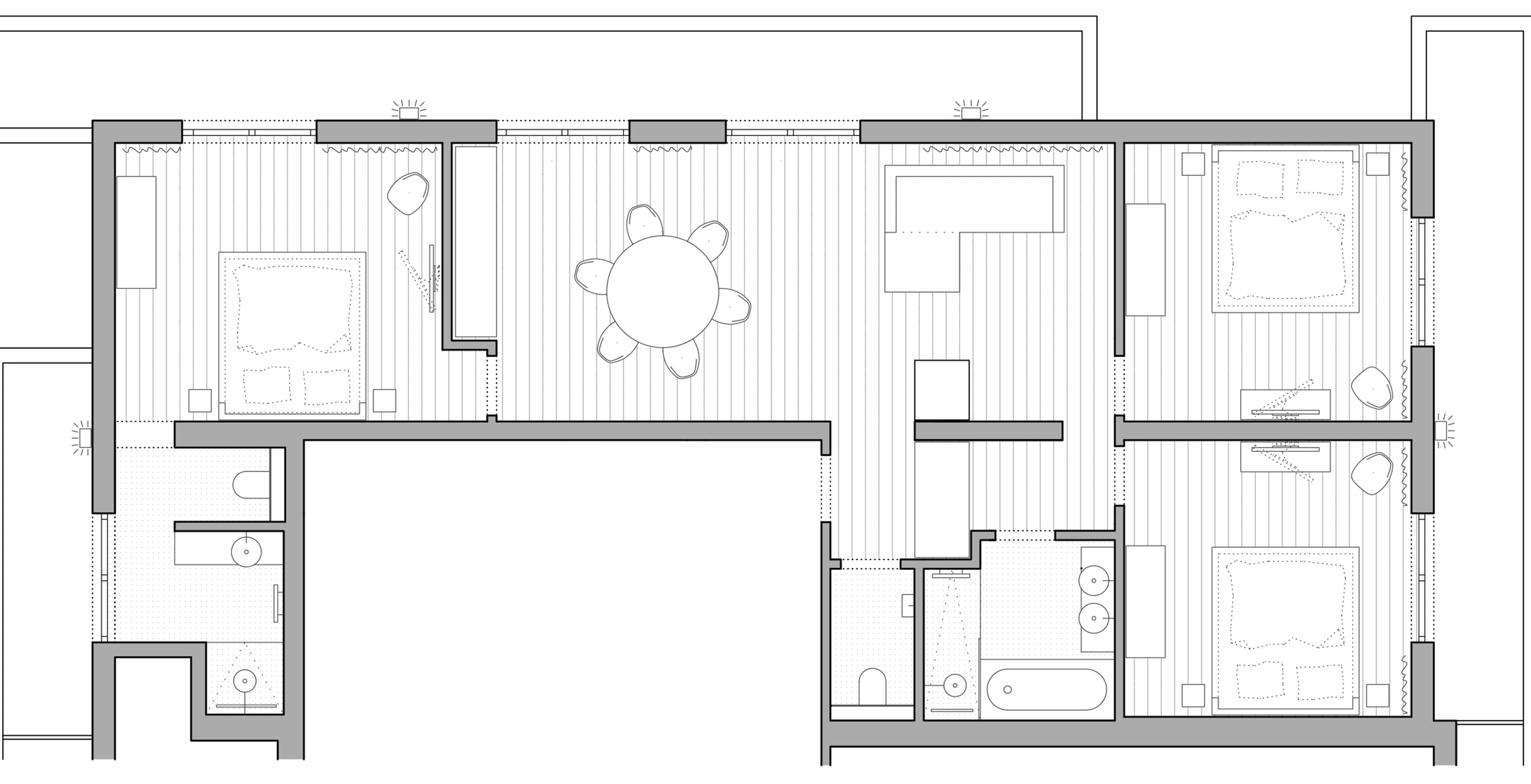 A floor plan of a hotel with a central dining area, multiple bedrooms, a bathroom, and a kitchenette.