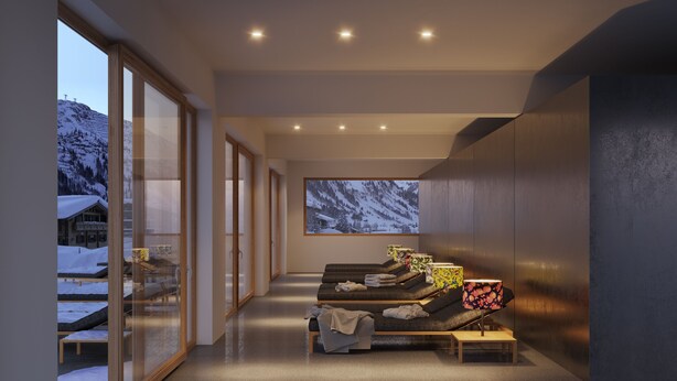 A modern spa room with a large window overlooking a snowy mountain, a relaxation area with benches, and a large framed picture of the mountain. - Appart Hotel Knappaboda (Lech am Arlberg)