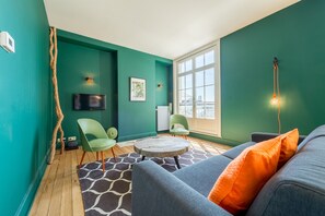 Signature Apartment, 2 Bedrooms | Living area | Flat-screen TV