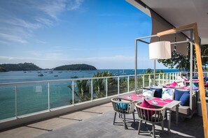 Enjoy breathtaking views of the sea and surrounding coastline from this balcony.