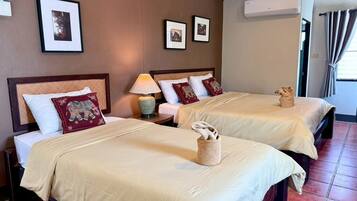 Triple Room | Desk, blackout drapes, free WiFi, bed sheets