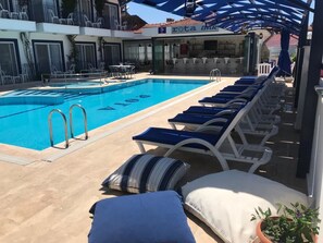 Seasonal outdoor pool, pool umbrellas, sun loungers
