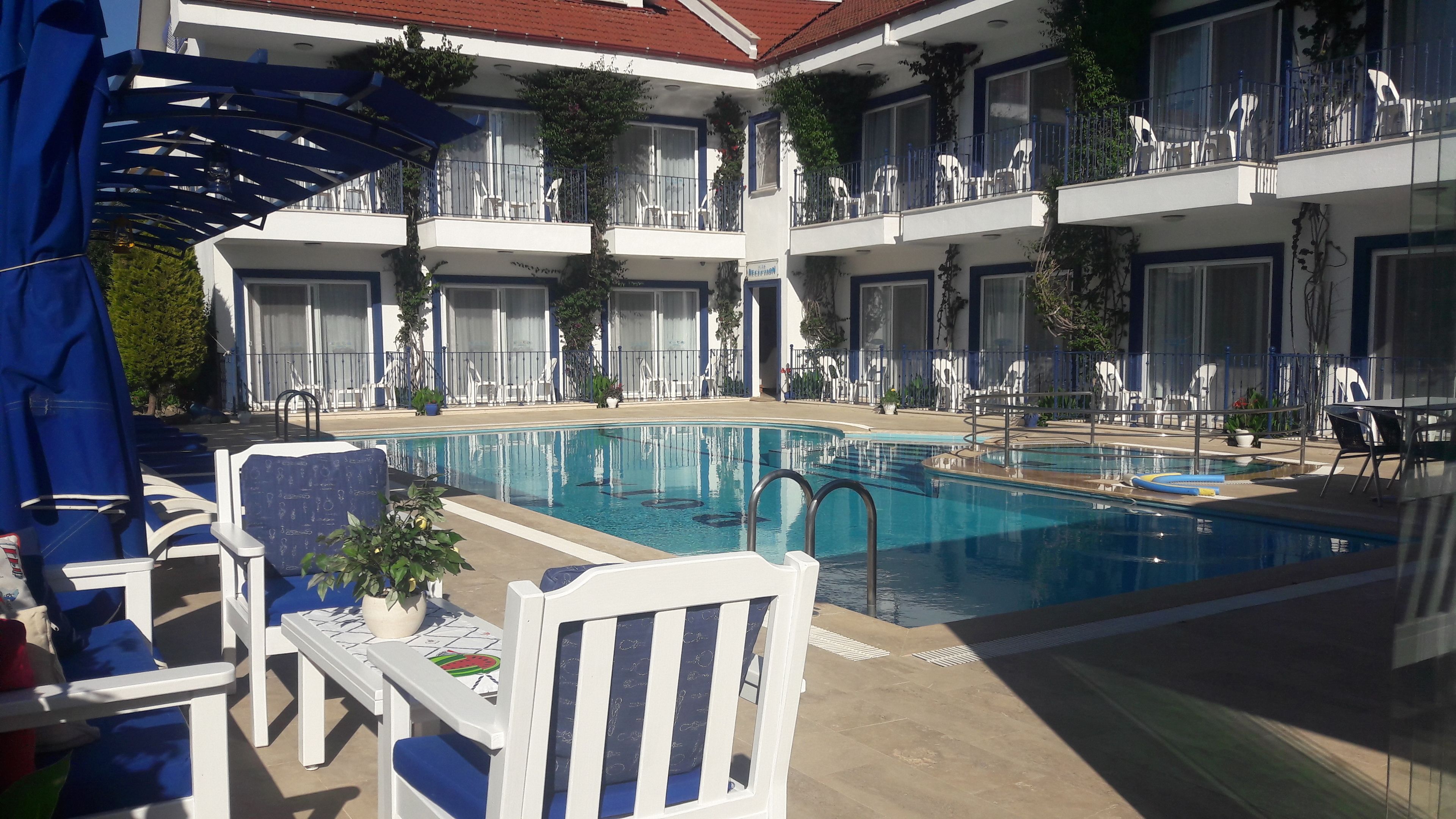 seasonal outdoor pool, pool umbrellas, pool loungers