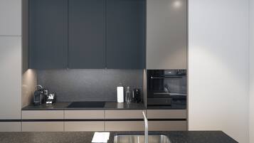 Une cuisine moderne avec des meubles de couleur sombre, un évier en acier inoxydable et un four encastré.