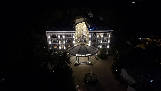 A large, multi-story hotel with a central courtyard and a prominent entrance. - Boulevard Hotel (Phu Quoc)