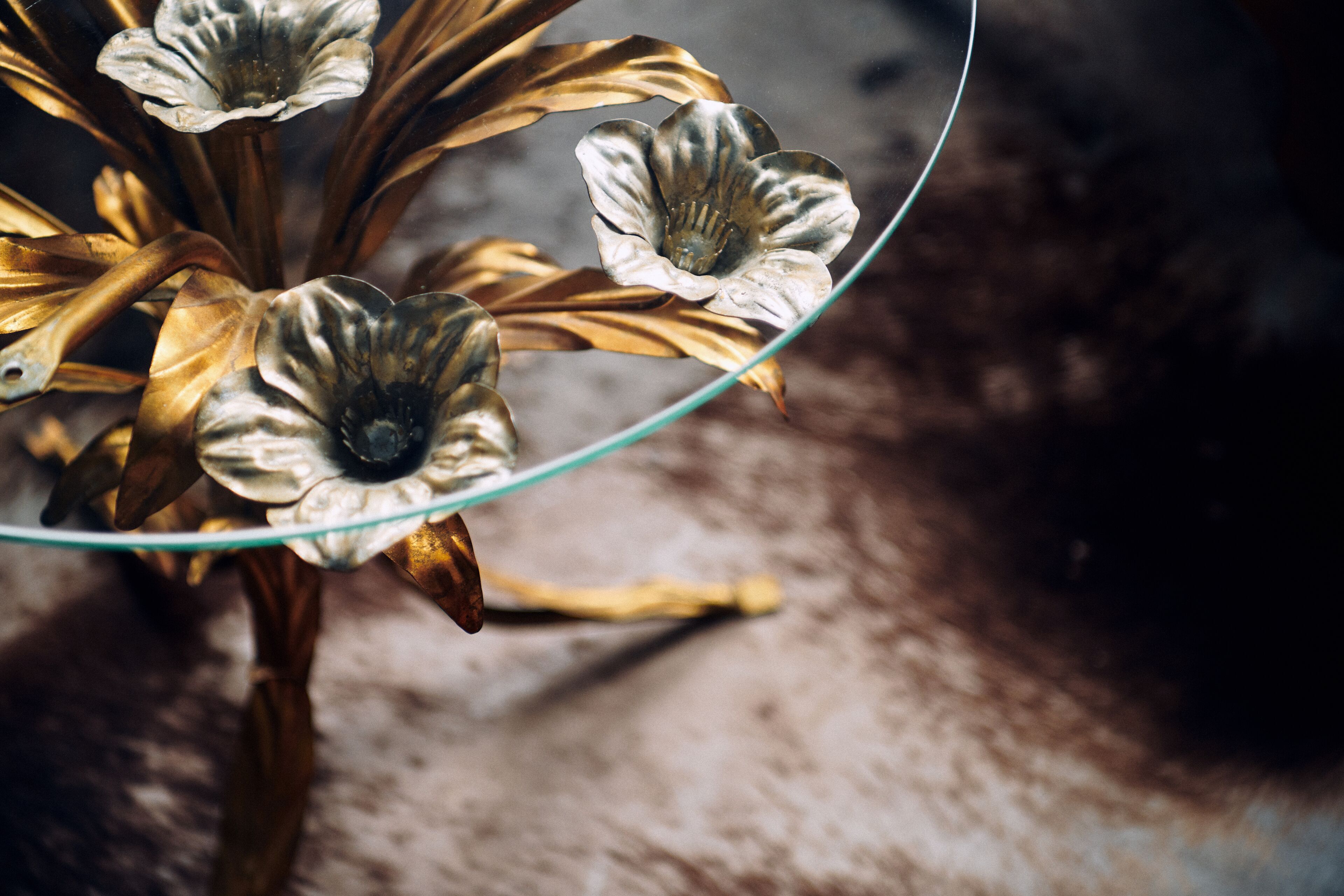 A close-up of a decorative glass object with a metallic finish, possibly a part of interior decor.