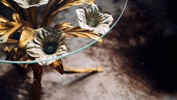A close-up of a decorative glass object with a metallic finish, possibly a part of interior decor.