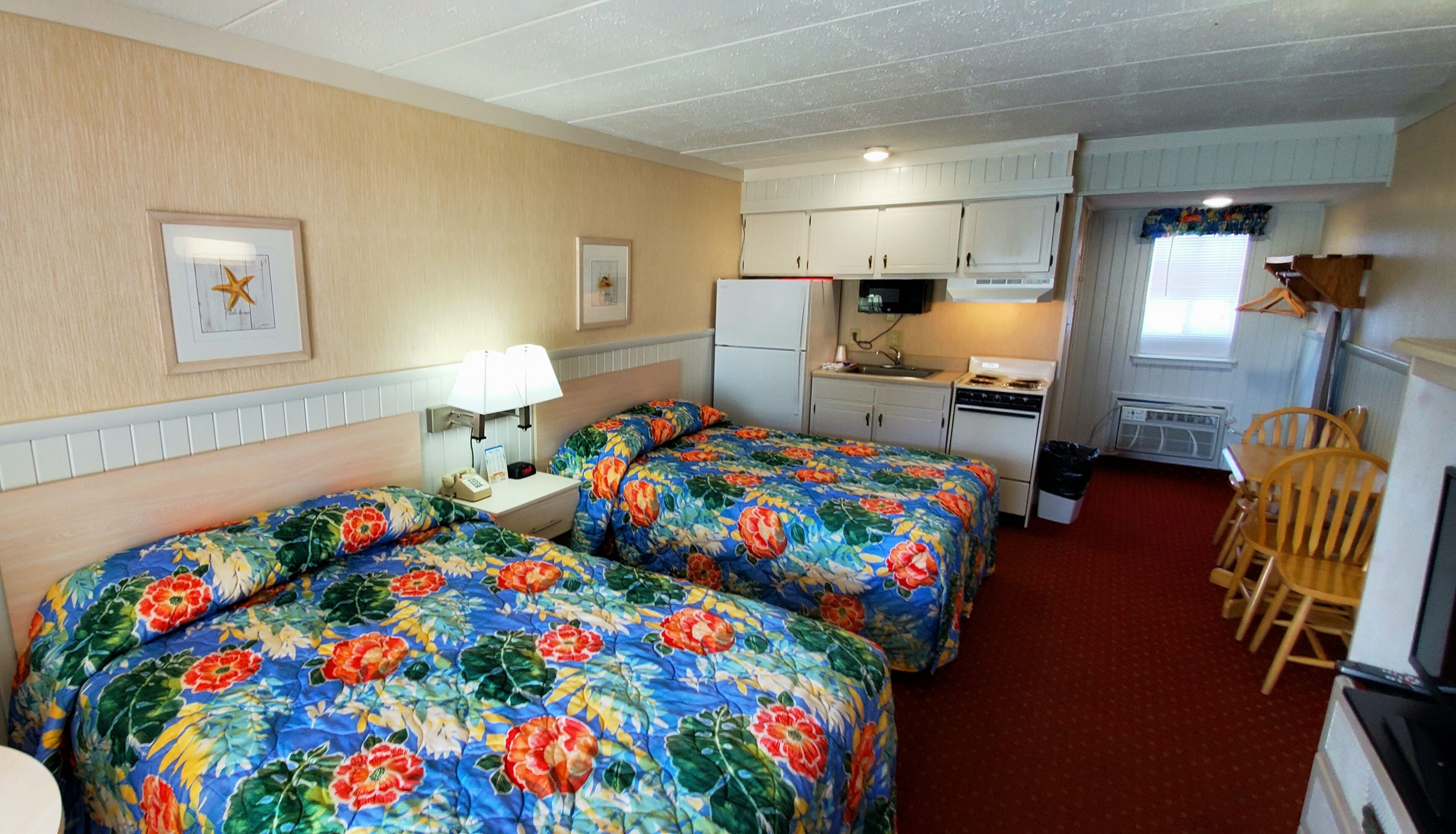 room, 2 queen beds, kitchenette | living area | flat-screen tv