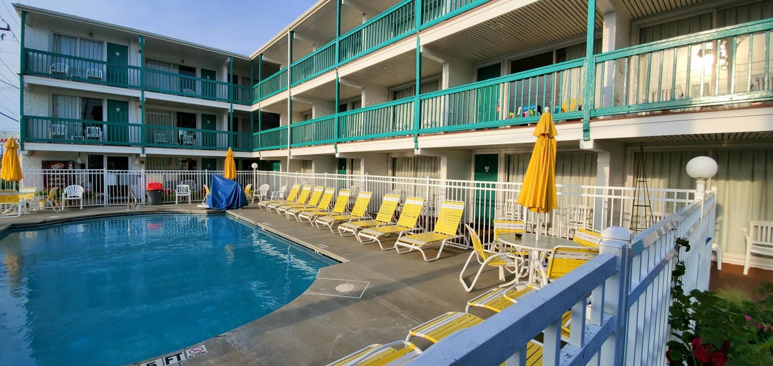 seasonal outdoor pool, pool umbrellas, pool loungers