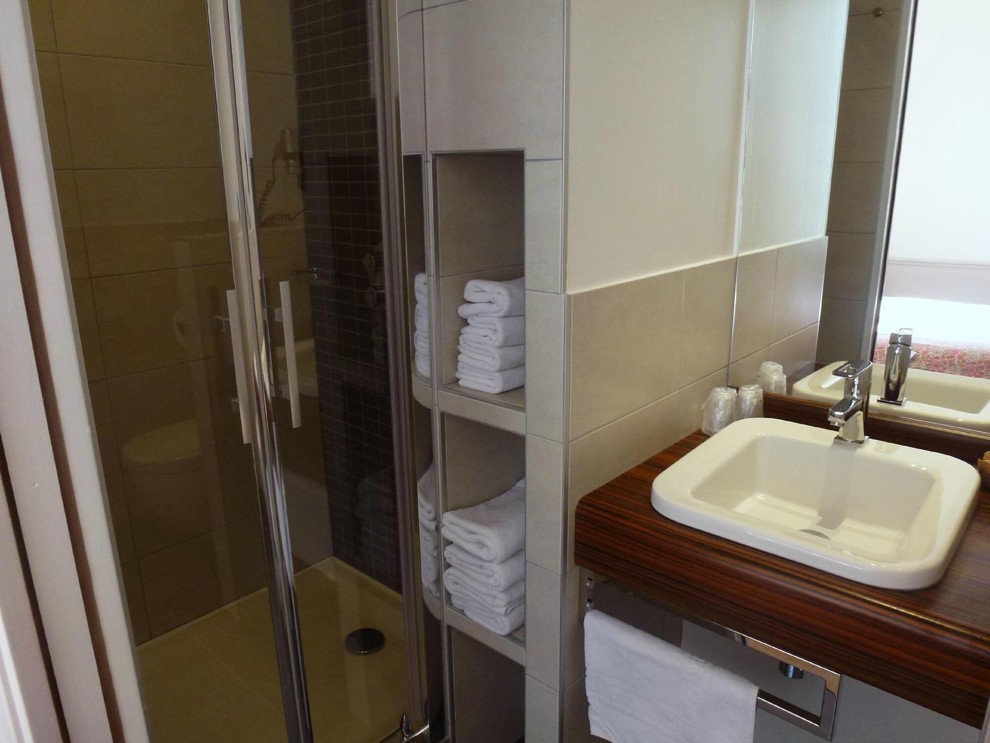 comfort twin room | bathroom | shower, rainfall showerhead, free toiletries, hair dryer