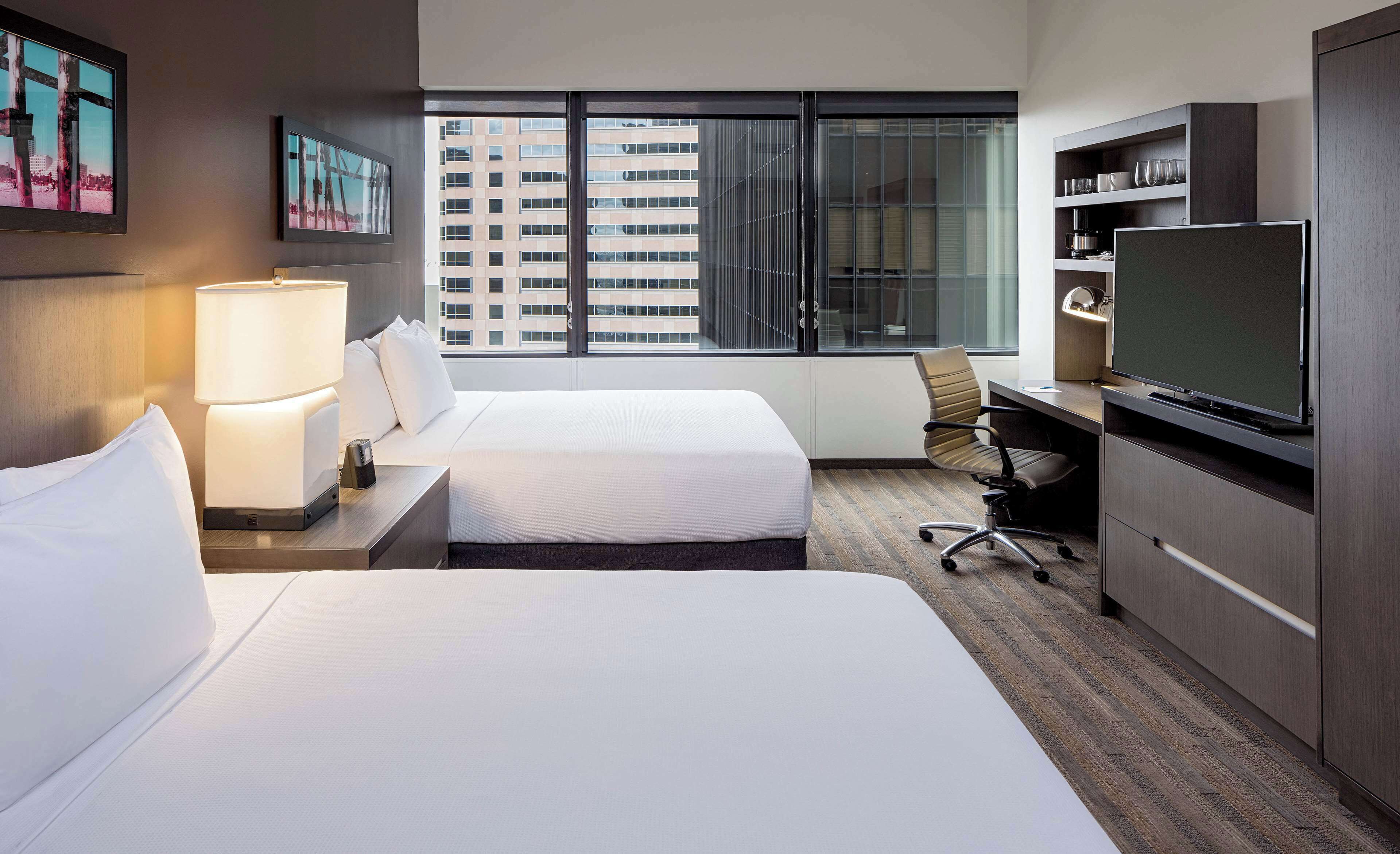 hypo-allergenic bedding, down duvets, desk, blackout curtains