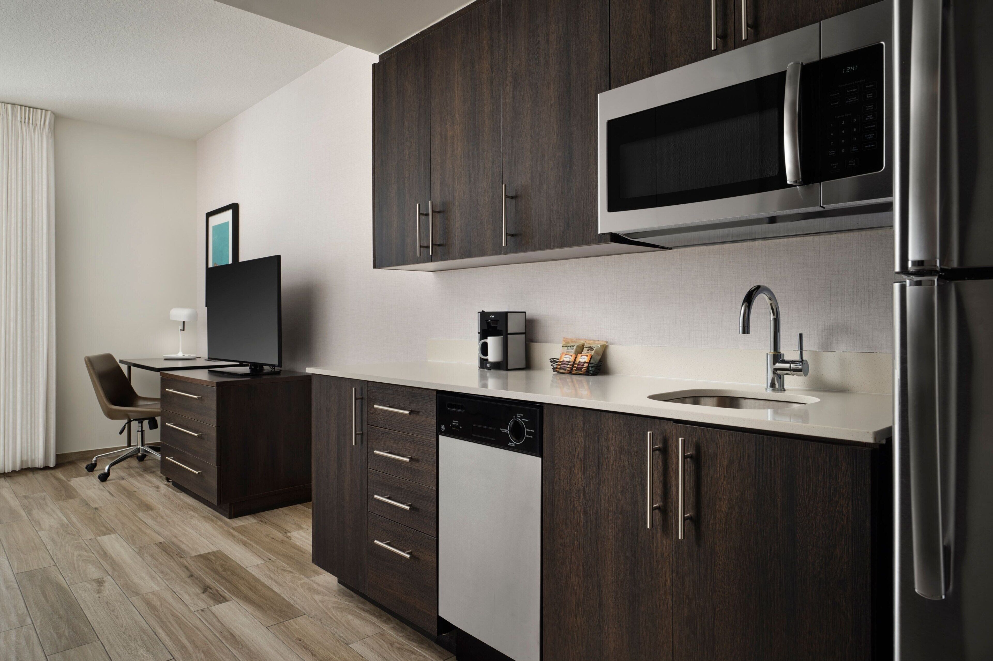 full-sized fridge, microwave, dishwasher, coffee/tea maker