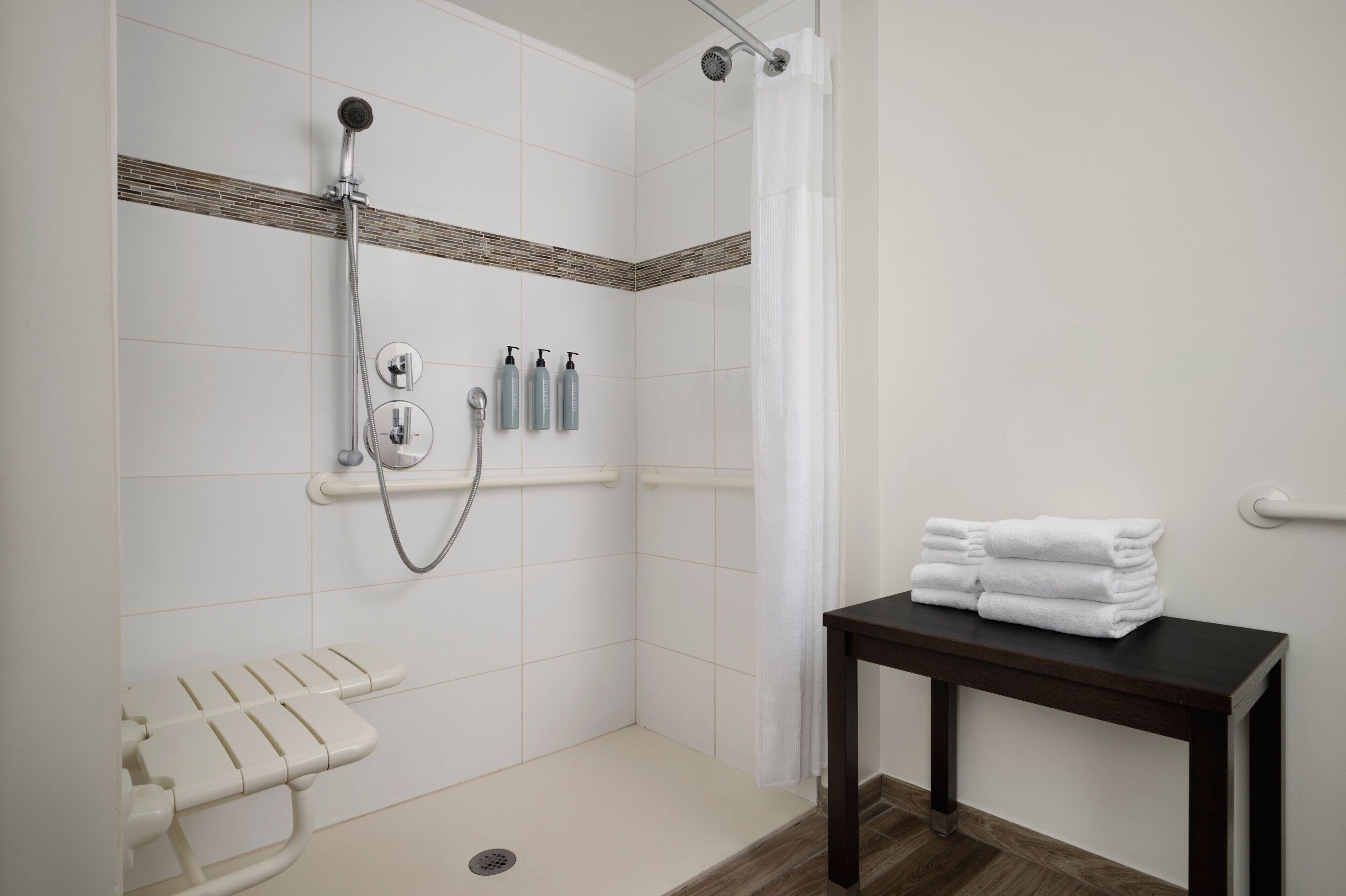 suite, 1 bedroom (mobility accessible, roll-in shower) | bathroom | shower, free toiletries, hair dryer, towels