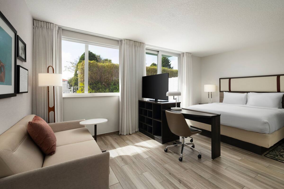 suite, 1 king bed, patio | 1 bedroom, down duvets, in-room safe, desk