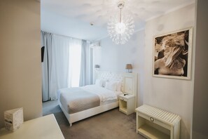 Habitación individual | Minibar, caja de seguridad en la habitación, escritorio y wifi gratis