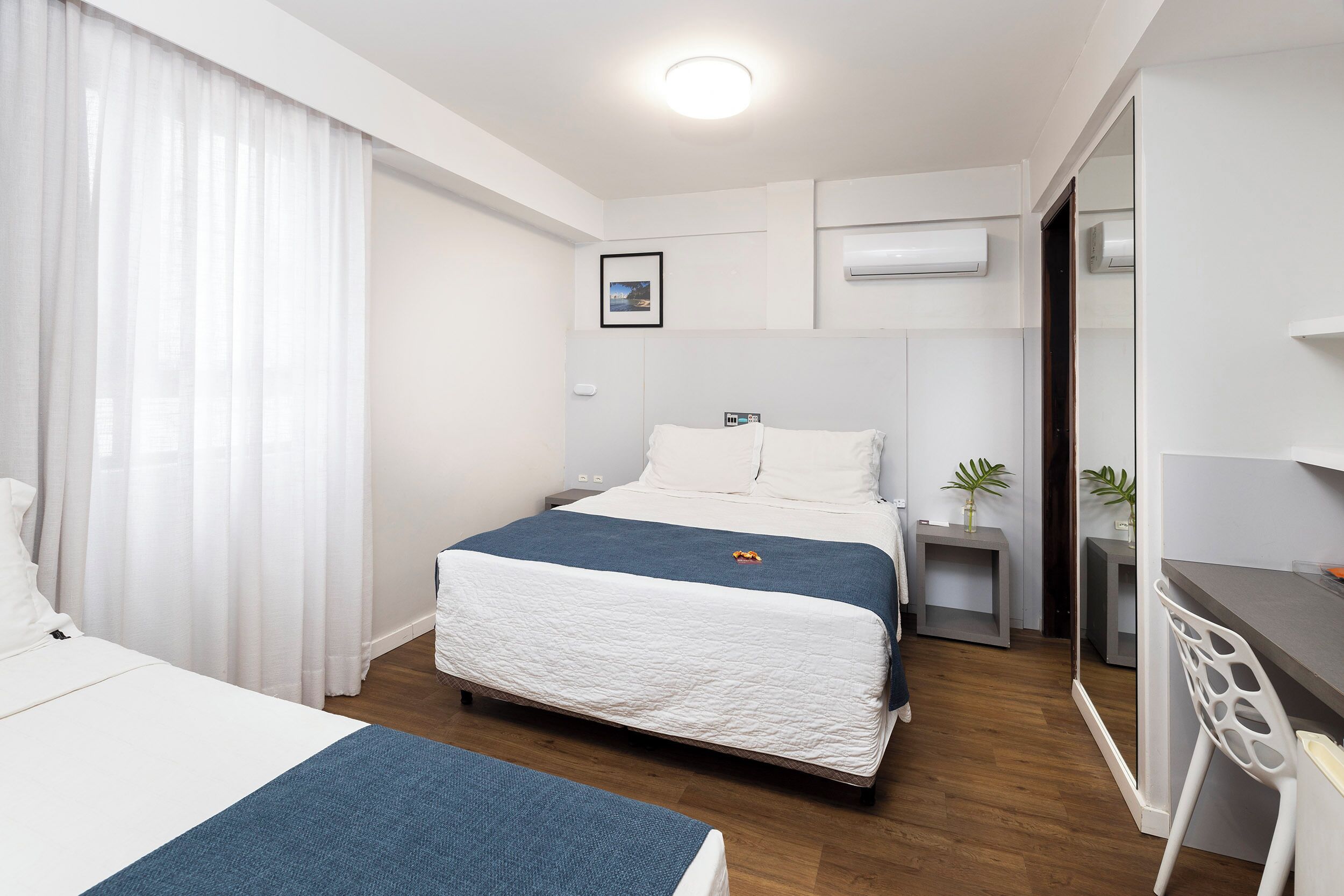 triple room | minibar, in-room safe, desk, blackout curtains