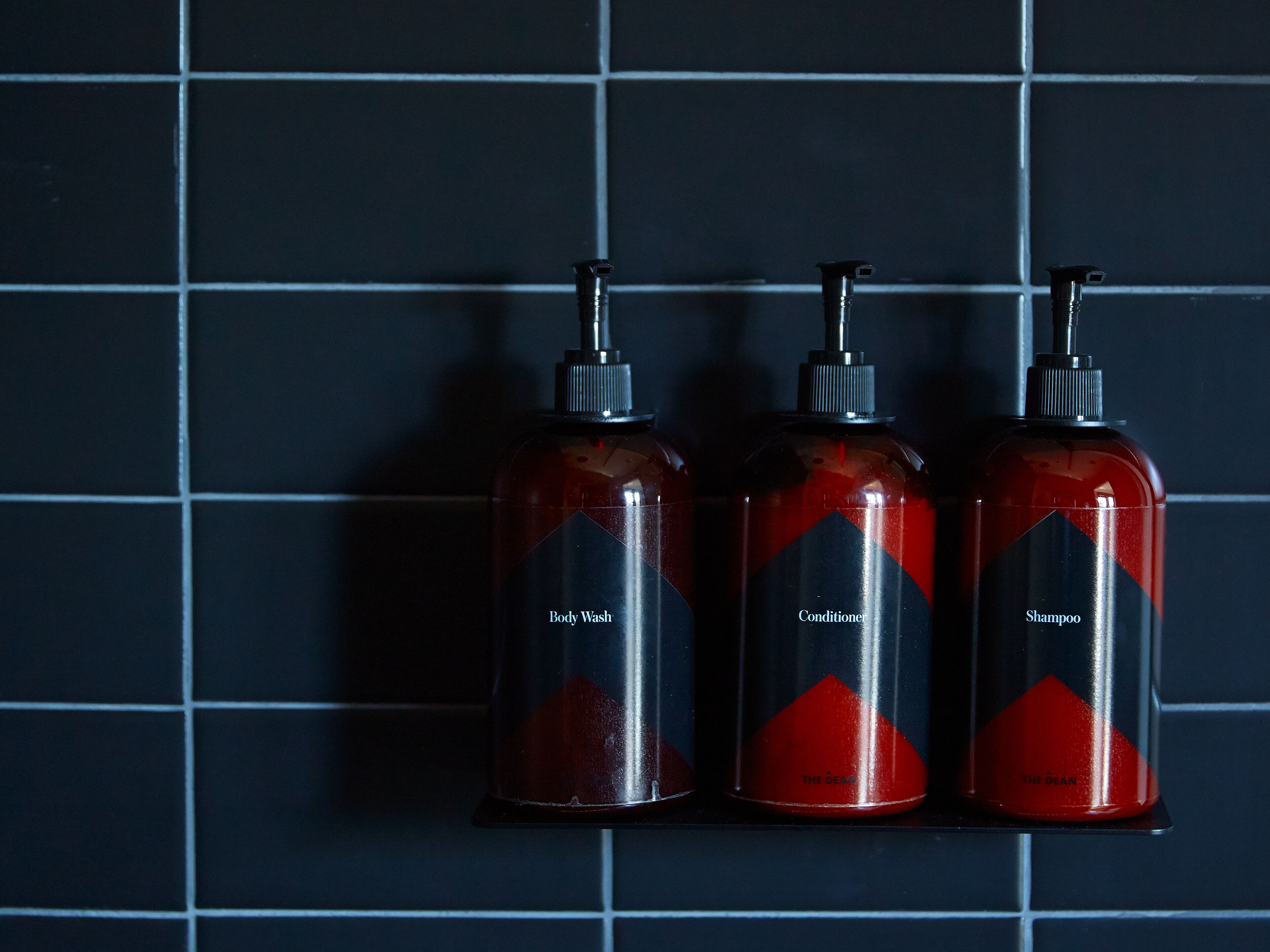 shower, designer toiletries, hair dryer, towels