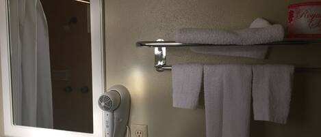 Shower, hair dryer, towels