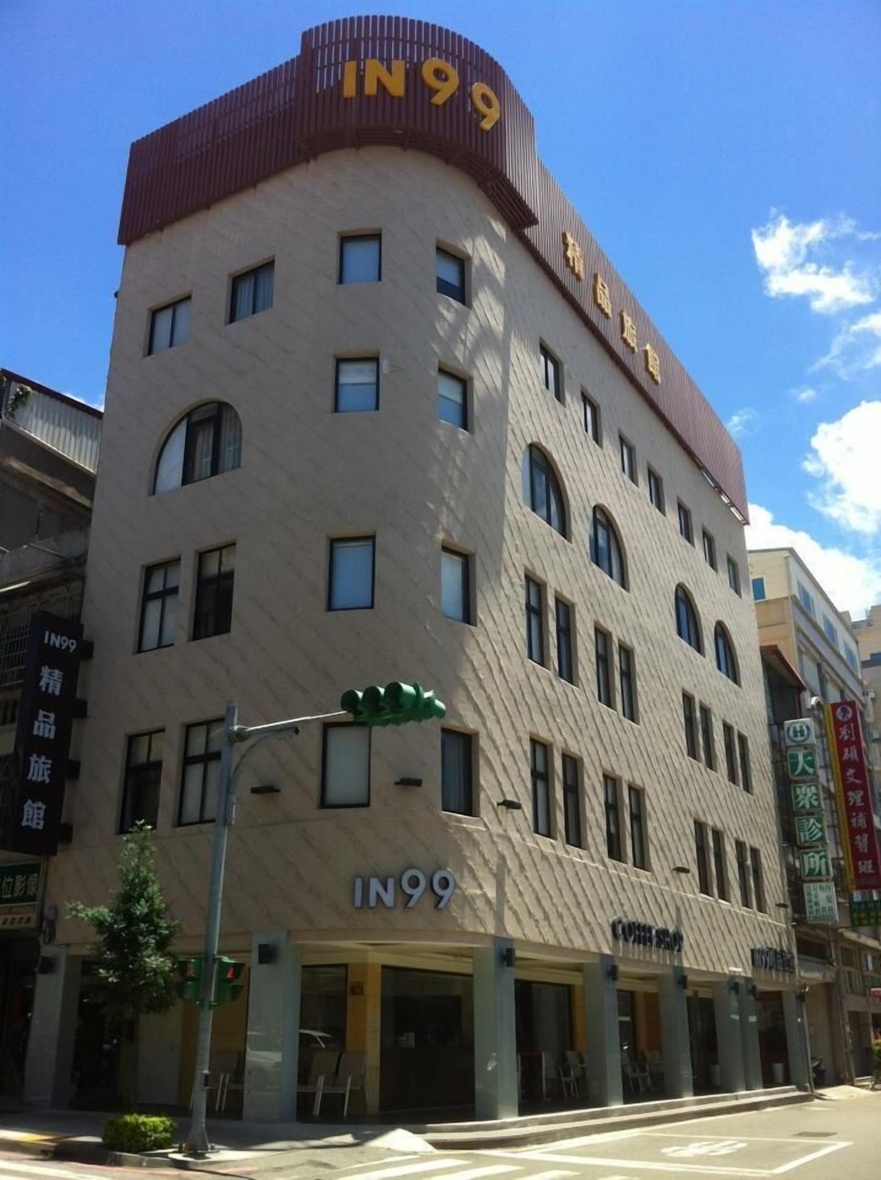 A multi-story hotel with a distinctive curved roof and the number "IN99" prominently displayed.
