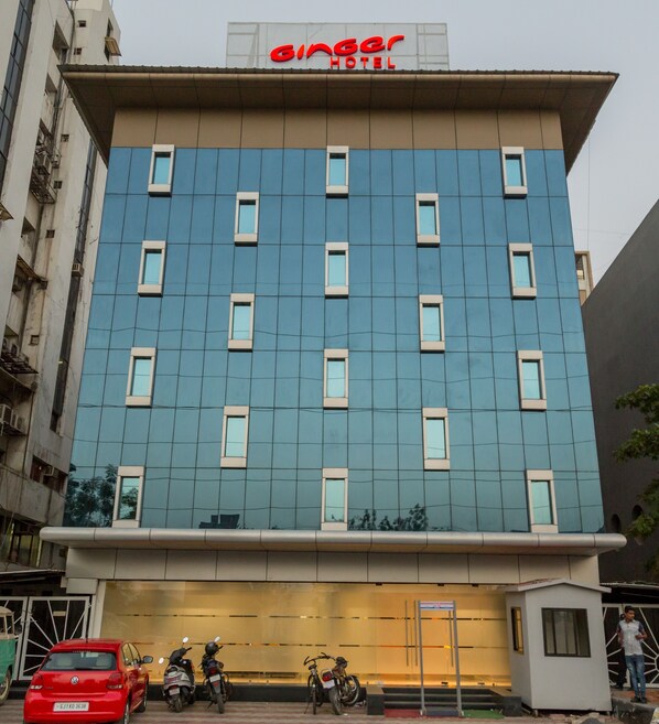 A modern building with a sign reading "Ginger Hotel" above the entrance. - Ginger Ahmedabad, Satellite (Ahmedabad)