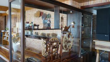A display case with antique mechanical toys and gears.